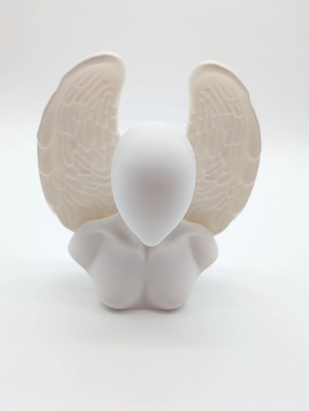 Ethereal Sentinels: The Faceless Angel Statue