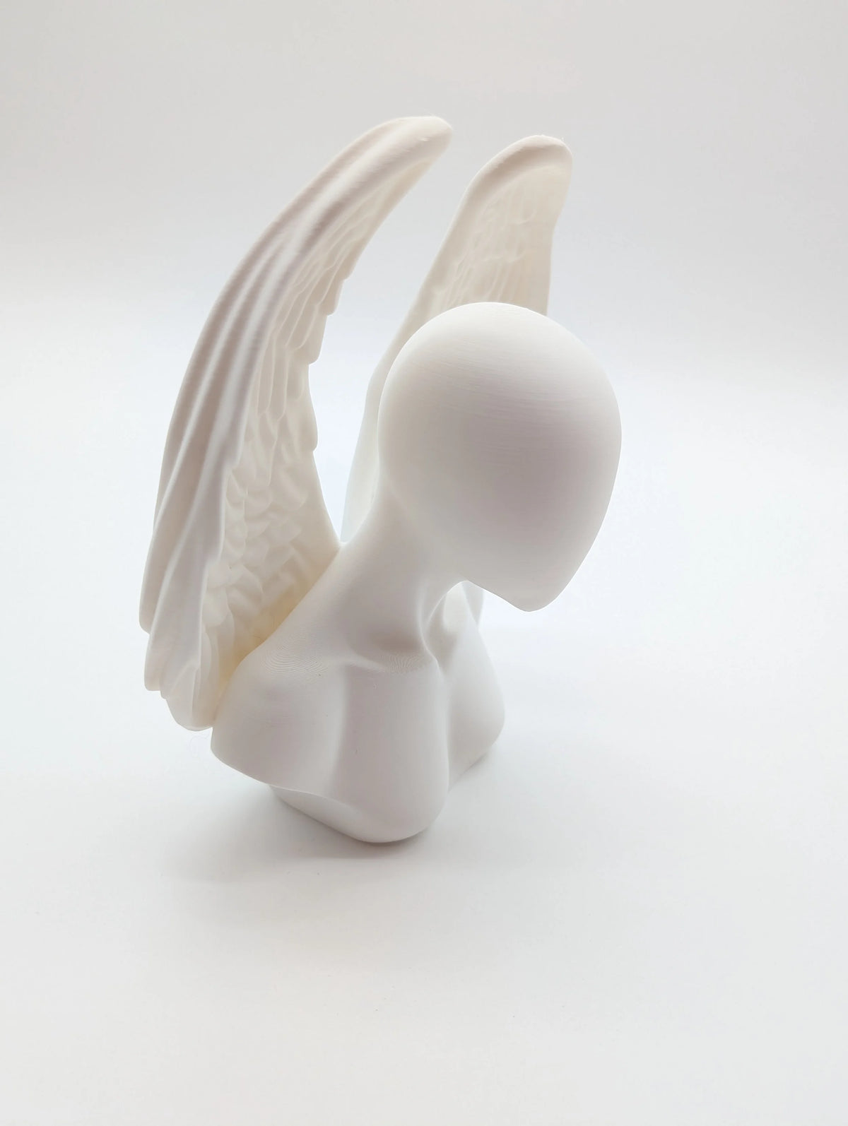 Ethereal Sentinels: The Faceless Angel Statue