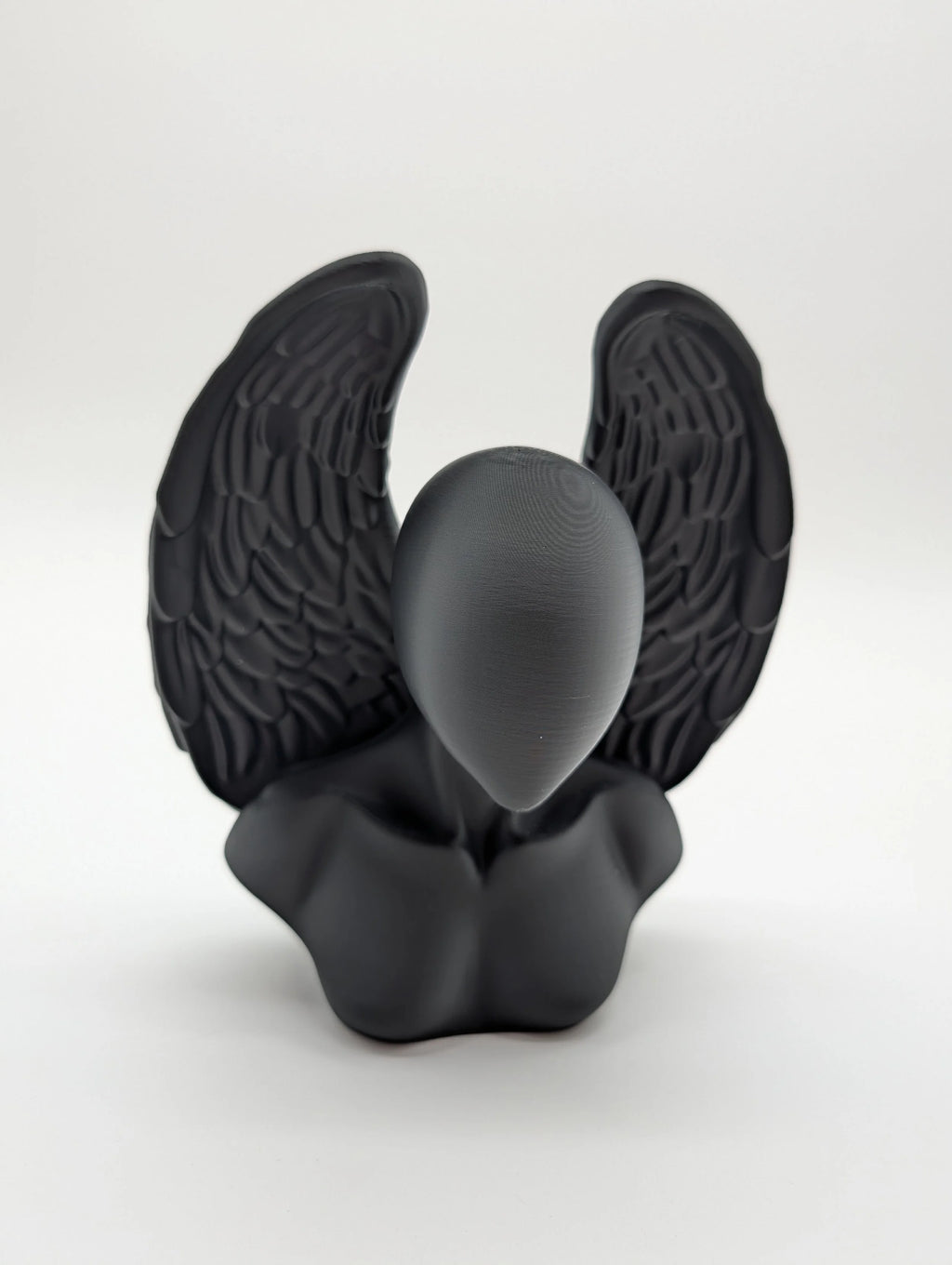 Ethereal Sentinels: The Faceless Angel Statue