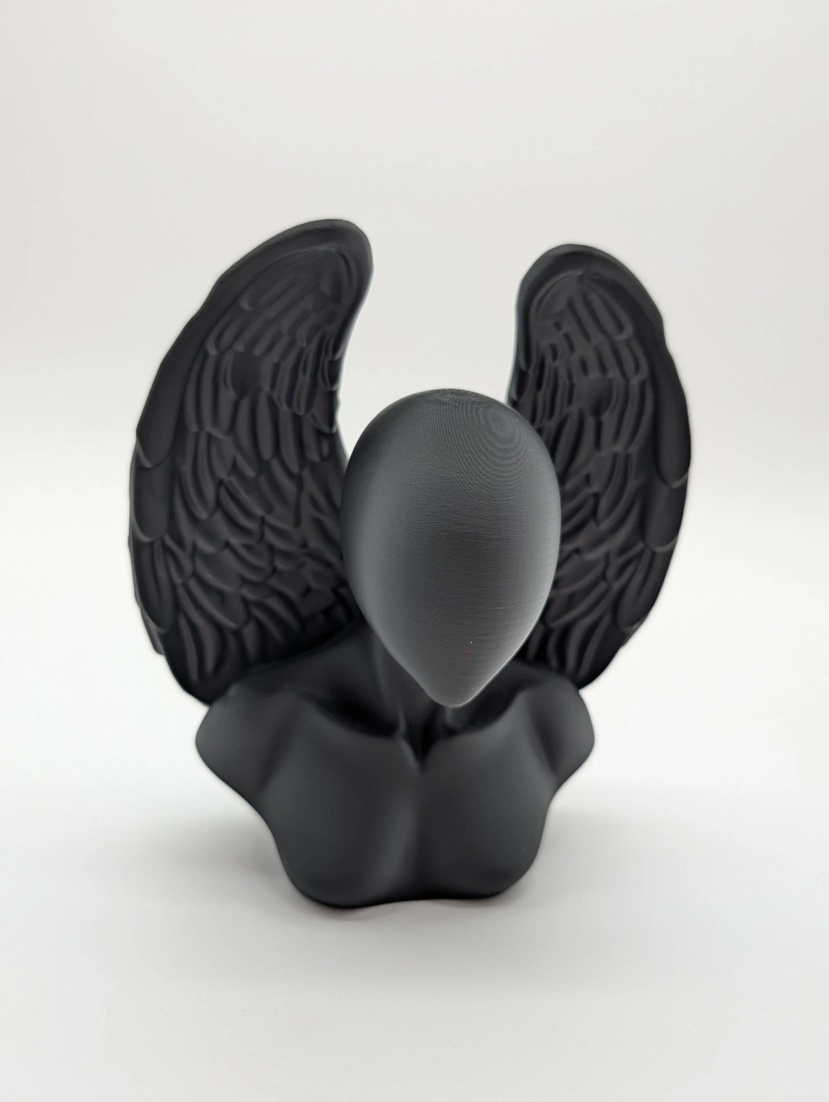 Ethereal Sentinels: The Faceless Angel Statue
